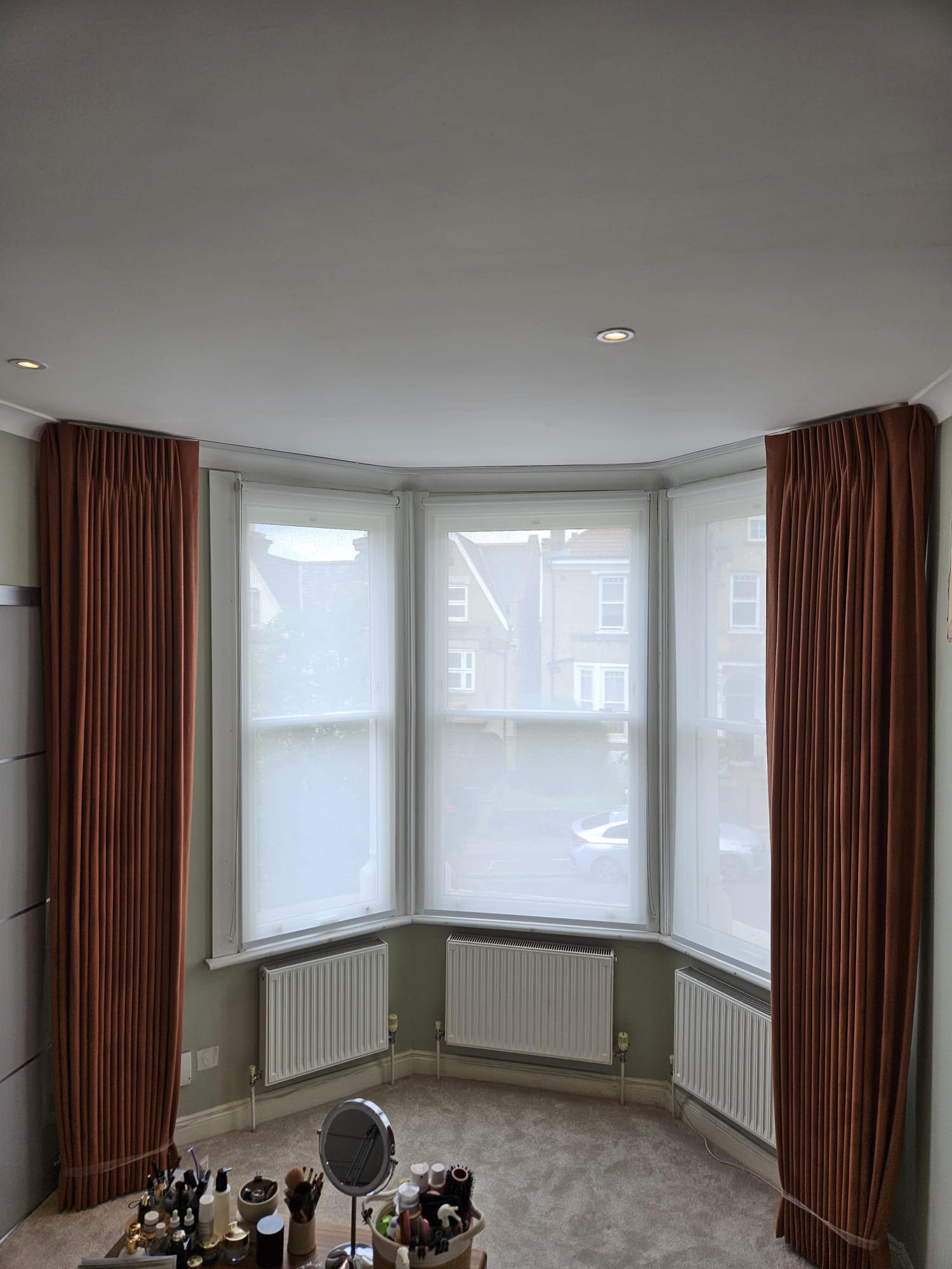 Europleat Curtains for North London Bay Window, curtains open displaying the sheer privacy blinds behind